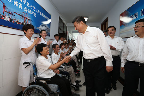 习近平：全面建成小康社会，残疾人一个也不能少