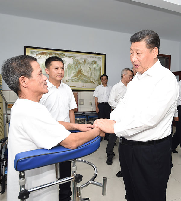 习近平：全面建成小康社会，残疾人一个也不能少